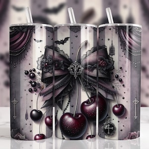 May include: Three stainless steel tumblers with straws, featuring a gothic design. The design includes a large bow, cherries, bats, and decorative elements in shades of black, gray, and burgundy. The background has vertical stripes and ornate details.