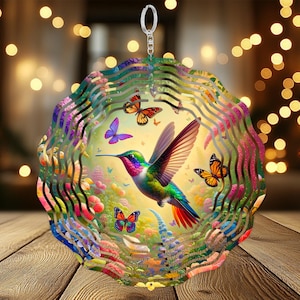 May include: A colorful metal wind spinner with a hummingbird and butterflies. The hummingbird is green, blue, and red with a long beak. The butterflies are blue, purple, yellow, and orange. The wind spinner is suspended from a silver hook.