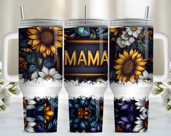 May include: Three stainless steel tumblers with a white background and a floral design featuring sunflowers, daisies, and a gold sign that says "MAMA".