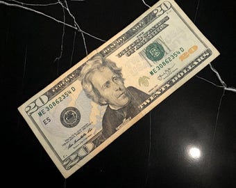 Billete auténtico de 20 dólares estadounidenses, con la imagen del presidente estadounidense Jackson.