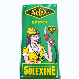 May include: A vintage green metal sign with a retro illustration of a woman in a yellow uniform holding a red gas pump. The sign displays the "Solex" logo, and the text "EXIGEZ" and "SOLEXINE" in yellow and white.
