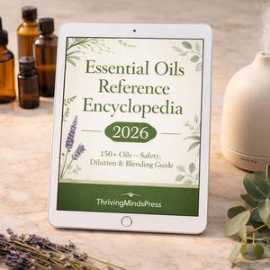 May include: A digital tablet displays the cover of the "Essential Oils Reference Encyclopedia 2026". The image includes amber glass bottles, a diffuser, and sprigs of lavender and eucalyptus. The book cover text includes "150+ Oils - Safety, Dilution & Blending Guide".