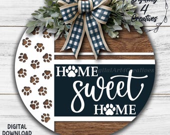 May include: A round wooden sign with a white paw print design and the words "Home Sweet Home." The sign has a navy blue and white checkered bow and greenery. The words "Digital Download" and file types are at the bottom.