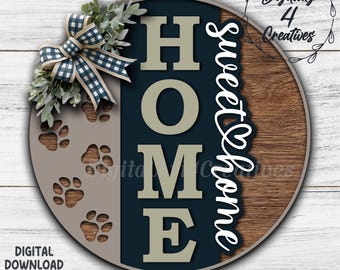 May include: Round wooden sign with the word "HOME" in large letters, a section with paw prints, and the words "Sweet Home" in cursive. It has a blue and white checkered bow and greenery. The sign is a digital download.