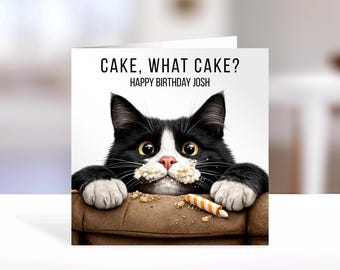 May include: A square greeting card featuring a black and white cat with crumbs on its face, resting on a brown surface. The text reads CAKE, WHAT CAKE? HAPPY BIRTHDAY JOSH. A small orange and white striped candle lies next to the cat's paws.