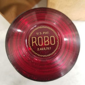 Vintage Robo Knife Sharpener red lucite, patented under U.S. Patent 2,469,797