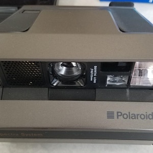 Polaroid Spectra system instant camera with 2 film packs sealed vintage camera