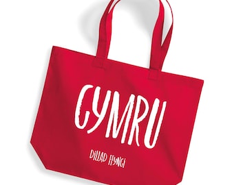 A cute, stylish maxi tote bag in a range of colours with a cool text CYMRU logo - multifunctional, reusable and sustainable.