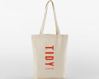 A cute stylish mini tote bag in a wide range of colours with a cool distressed text TIDY logo - multifunctional, reusable and sustainable.