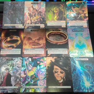 May include: Nine Magic: The Gathering cards featuring various illustrations. The cards include Orc Army, Goblin Shaman, Treasure, Clue, and Energy Counter. The cards are holographic and have a foil finish.