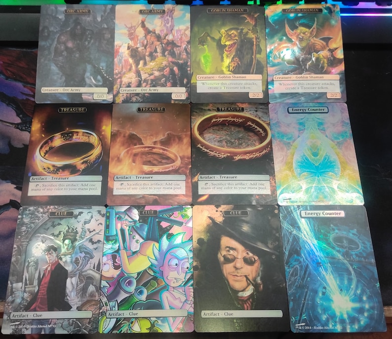 May include: Nine Magic: The Gathering cards featuring various illustrations. The cards include Orc Army, Goblin Shaman, Treasure, Clue, and Energy Counter. The cards are holographic and have a foil finish.