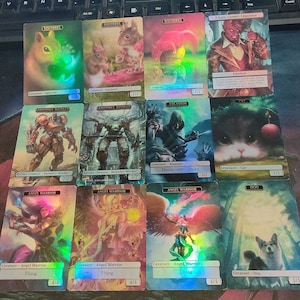 May include: A collection of nine holographic trading cards featuring various creatures and characters. The cards are arranged in three rows of three. The top row features a squirrel, a squirrel, and a character named Tihalt, Cosmic Impostor. The middle row features a robot, a robot, an assassin, and a cat. The bottom row features an angel warrior, an angel warrior, an angel warrior, and a dog.
