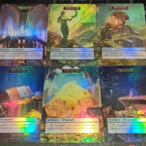 May include: Six holographic Magic: The Gathering cards featuring the "Treasure" artifact. Each card has a different image of a treasure chest, a pile of gold coins, or a building with a treasure inside. The text on the cards reads "Artifact - Treasure" and "Sacrifice this artifact: Add one mana of any colour to your mana pool."