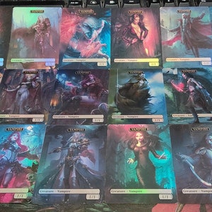 May include: A collection of 18 trading cards featuring various vampire characters. The cards are holographic and have a dark, gothic aesthetic. Each card features a different vampire with unique artwork and details.