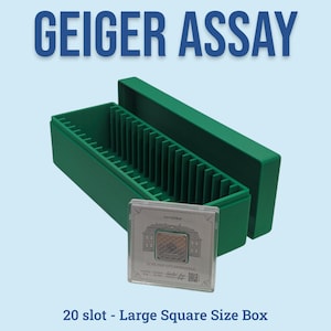 May include: Green plastic storage box with 20 slots, open to reveal the interior. A clear square case with a coin is in front of the box. The text "GEIGER ASSAY" is at the top, and "20 slot - Large Square Size Box" is at the bottom.