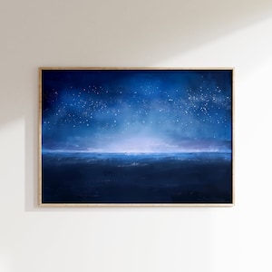 May include: A framed abstract painting of a dark blue night sky with a horizon line and white stars. The painting has a light blue and purple gradient.