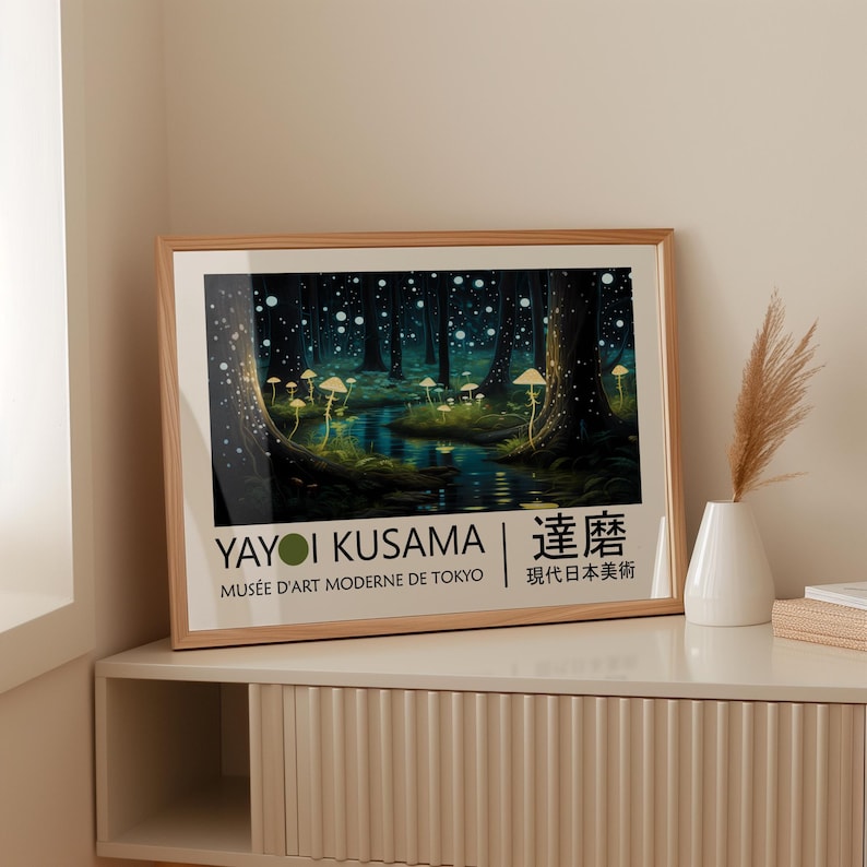 May include: A framed poster with a dark green forest scene with glowing white dots and mushrooms. The poster has the text "Yayoi Kusama | Kusama | Mus&eacute;e d'Art Moderne de Tokyo | 現代日本美術" in black and white.