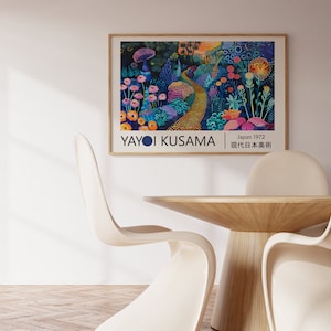 May include: A framed poster featuring a colourful abstract painting of a garden with flowers, mushrooms, and a winding path. The artist's name, "Yayoi Kusama", is printed in white at the bottom of the poster, along with the text "Japan 1972" and "現代日本美術".