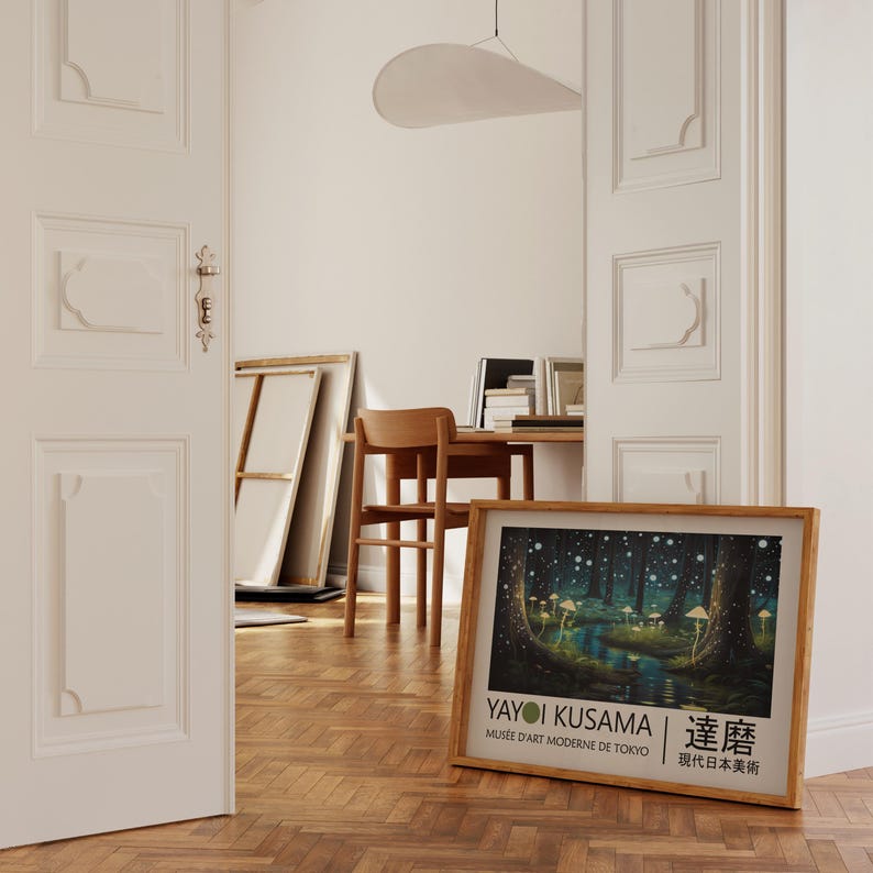 May include: A framed poster with a colorful illustration of a forest with glowing mushrooms. The poster is titled "Yayoi Kusama" and features the text "Musee d'Art Moderne de Tokyo" and "草間" in Japanese.