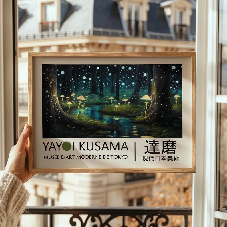 May include: A framed poster with a painting of a glowing forest with a stream running through it. The poster features the text "Yayoi Kusama | 靉靆  Mus&eacute;e d'Art Moderne de Tokyo |  現代日本美術"