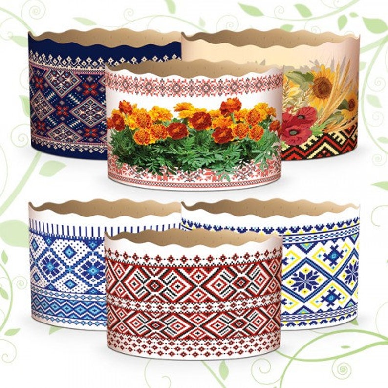 Może przedstawiać: Zestaw sześciu białych papierowych foremek do pieczenia z r&oacute;żnymi kolorowymi wzorami haftowanymi. Wzory obejmują wzory kwiatowe, geometryczne i tradycyjne.