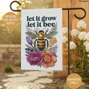 May include: A white garden flag with a bee and flowers. The text on the flag reads "let it grow let it bee".