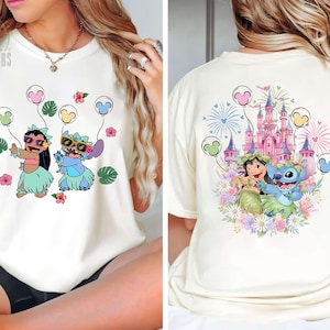 May include: A black tote bag with a white floral design. The bag has two handles and a rectangular shape. The floral pattern includes various flowers and leaves. The bag is made of a sturdy material.