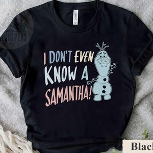May include: Black t-shirt with a cartoon snowman character and the text "I don't even know a Samantha!"
