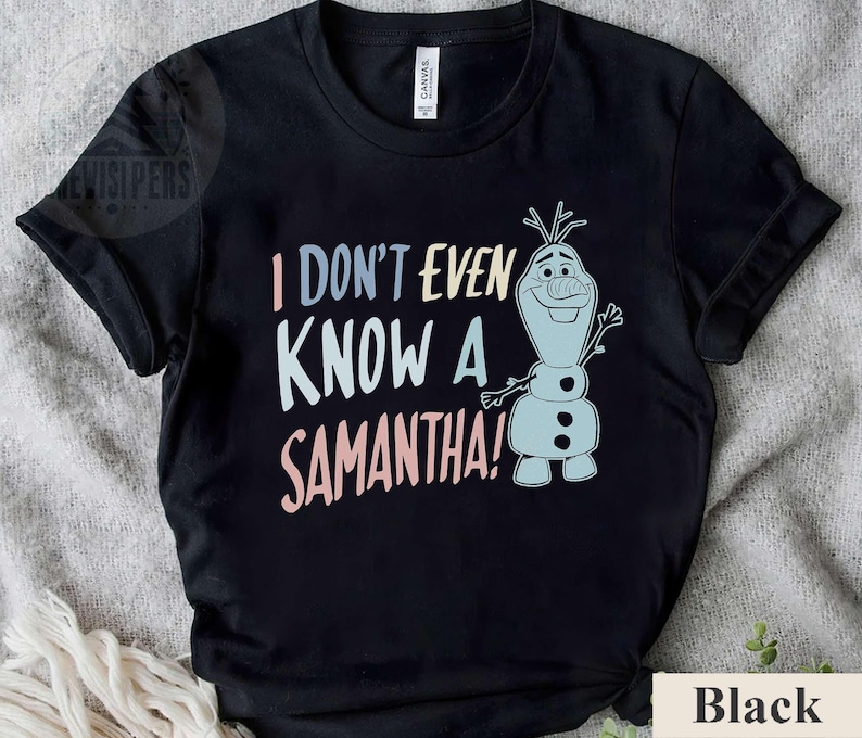 May include: Black t-shirt with a cartoon snowman character and the text "I don't even know a Samantha!"