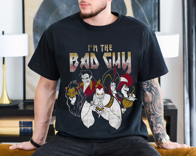 May include: Black t-shirt with a graphic of Disney villains including Scar, Maleficent, Jafar, and Ursula. The text "I'm the Bad Guy" is printed in a metal font above the villains.
