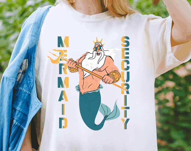 May include: White t-shirt with a graphic of King Triton from The Little Mermaid holding a trident. The text "Mermaid Security" is printed vertically on the shirt.