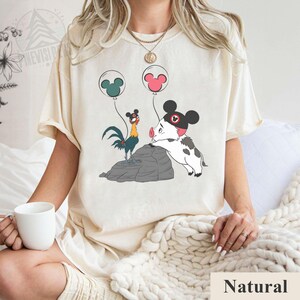 May include: A set of three ceramic mugs with a speckled, matte finish in cream, light grey, and dark grey. Each mug has a simple, minimalist design, suitable for coffee or tea.