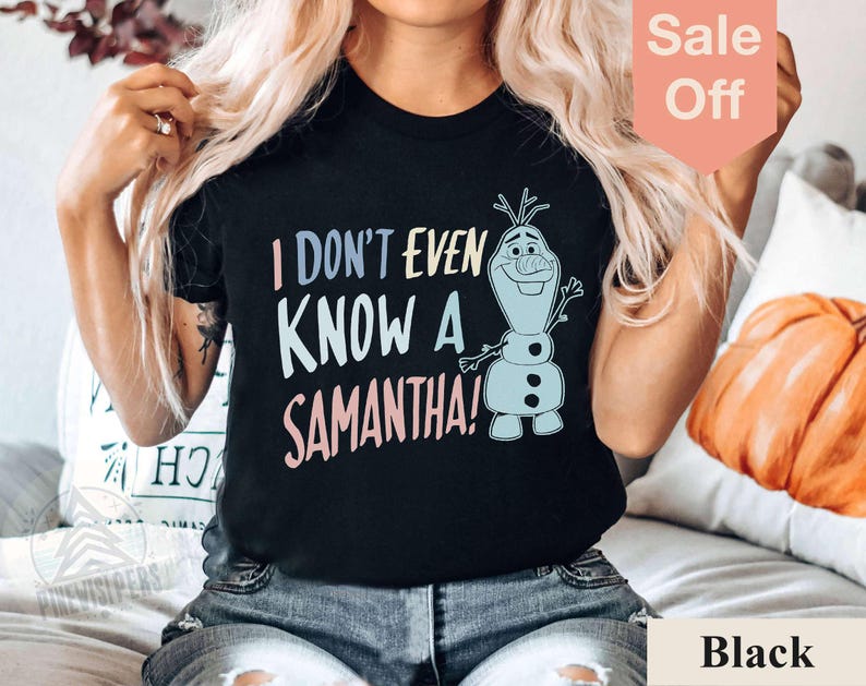 May include: Black t-shirt with a colorful graphic of Olaf from Frozen. The text on the shirt reads "I don't even know a Samantha!"
