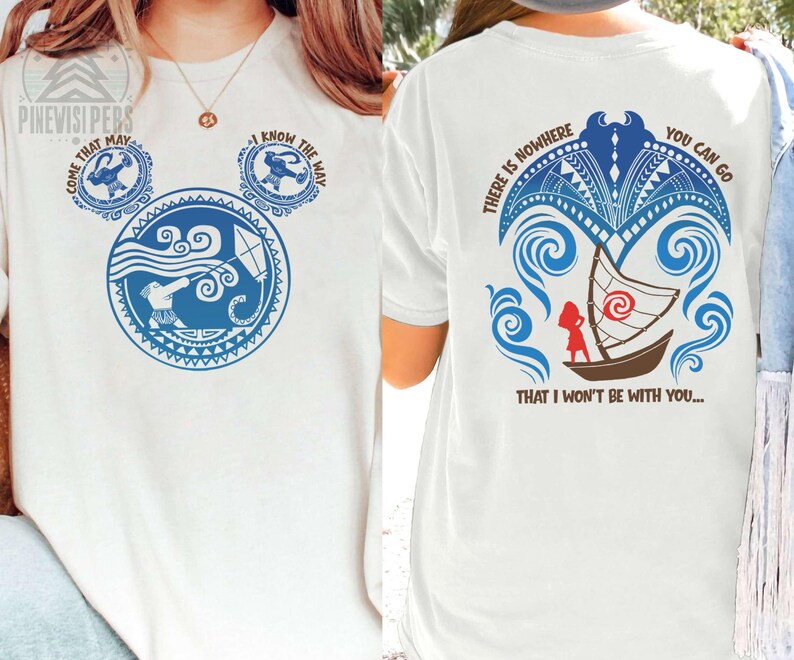 May include: White t-shirt with a blue graphic design on the front and back. The front design features a Mickey Mouse-shaped design with text that says "COME THAT MAY" and "I KNOW THE WAY". The back design includes a boat and the text "THERE IS NOWHERE YOU CAN GO THAT I WON'T BE WITH YOU..."