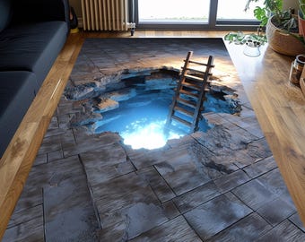 May include: A rectangular area rug with a 3D illusion design. The rug depicts a hole in a wooden floor, revealing a glowing blue light and a wooden ladder. The rug's color palette includes shades of gray, blue, and brown.