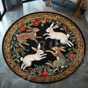 May include: A round black rug featuring four rabbits in various poses. The rabbits are surrounded by floral and vine designs in red, green, and gold. The rug has a decorative border.