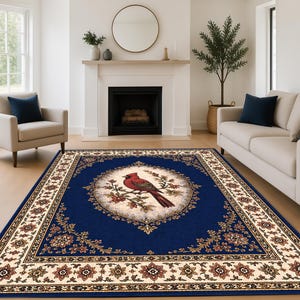May include: A rectangular area rug with a navy blue field and a cream-colored border. The center features a circular design with a red cardinal bird perched on a branch. Floral and ornamental patterns adorn the border.