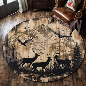 May include: Round, wooden rug with a mountain scene and silhouette of deer and a bird. The rug has a rustic, wood-grain design.