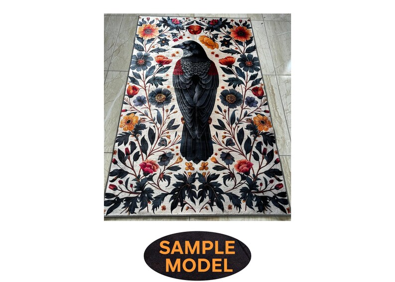 May include: Rectangular rug with a central image of a black crow with red detailing, surrounded by a floral design. The flowers are in orange, red, and blue hues, set against a white backdrop. The rug has a decorative border with a 'SAMPLE MODEL' text.