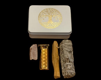 Unique On-The-Go Travel Kit. Includes sage, palo santo, gold lighter, stone and tin case with gold tree of life emblem.