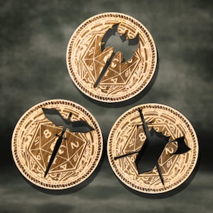 May include: Three wooden game pieces with etched designs. Each piece is circular with a detailed border and a central cutout depicting a weapon or symbol. The pieces are arranged on a dark background.