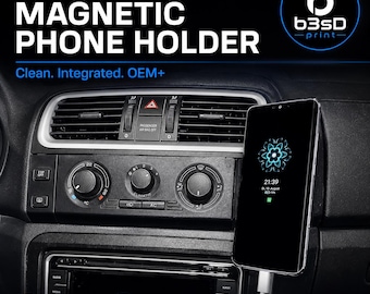 May include: A black car dashboard with a phone mounted on a magnetic phone holder. The phone displays a blue and green graphic. Text on the dashboard reads "SKODA FABIA / ROOMSTER MAGNETIC PHONE HOLDER". The image also includes the text "Clean. Integrated. OEM+".