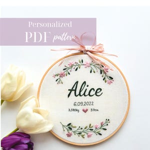 May include: A personalized PDF pattern featuring an embroidered hoop with the name "Alice", date, weight (3.590kg), and length (57cm). The design includes floral accents and a pink ribbon. The text "Personalized PDF pattern" is at the top.