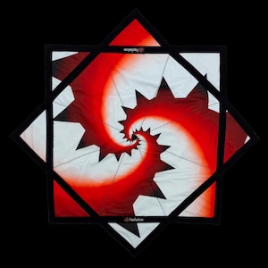 May include: A square, red and white patterned textile with a spiral design. The textile is framed by a black border and a black star-shaped outline. The design includes the text "trippysquid.com".