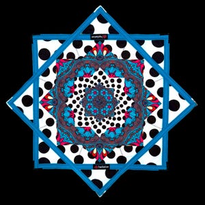 May include: A square fabric mat featuring a layered, geometric design with a white background and black polka dots. The center displays a vibrant, symmetrical pattern in shades of blue, red, and black, framed by a bright blue stitched border.