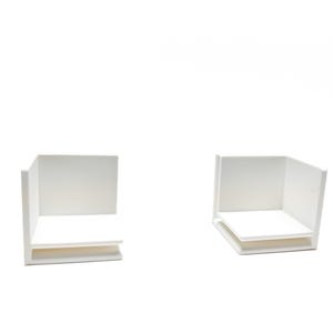 May include: Two white cardboard boxes with open tops and a single shelf inside each box.