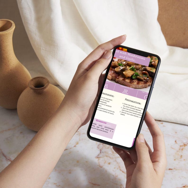 May include: A smartphone displaying a recipe for beef with mushrooms and garlic. The recipe includes ingredients, preparation steps, and benefits. The phone is held in a person's hand.