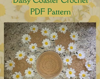 May include: A collection of handmade crochet daisy coasters and a round coaster. The coasters are beige with white and yellow daisy accents. The text "Daisy Coaster Crochet PDF Pattern" is displayed in a green banner.