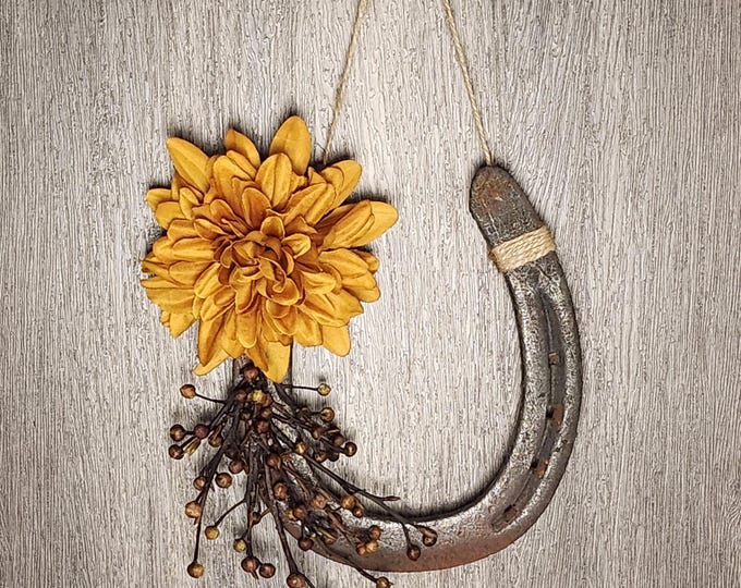 Hand decorated worn horseshoe