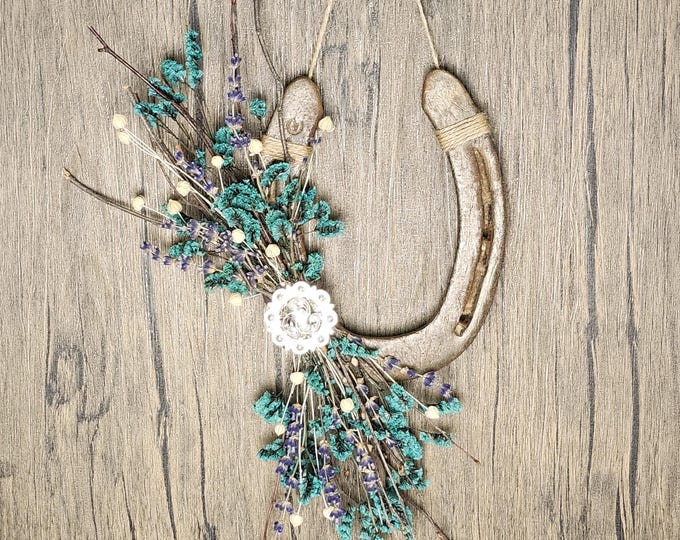 Hand decorated worn horseshoe